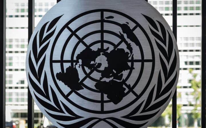 the united nations emblem is on display in front of a window